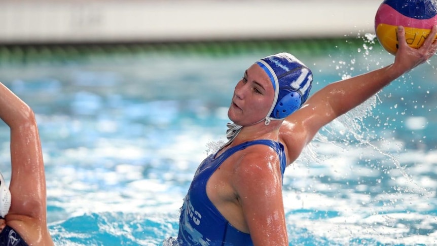 Elite waterpolo player Matilda Kearns in team cap about the hurl the ball at the goal.