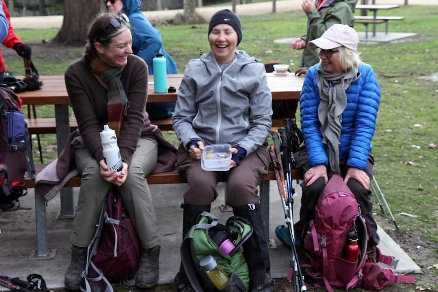 Three women laughing