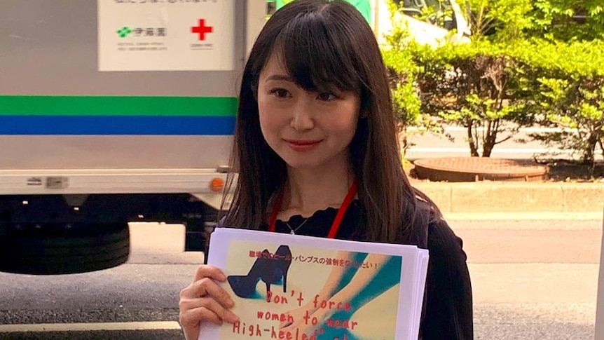A photo of Ms Ishikawa holding her petition.