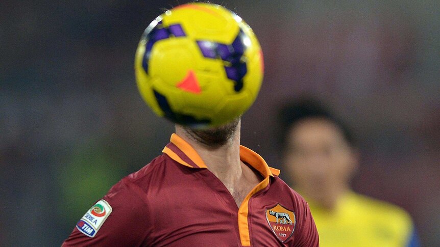 The ball covers the face of Miralem Pjanic during a Serie A match.