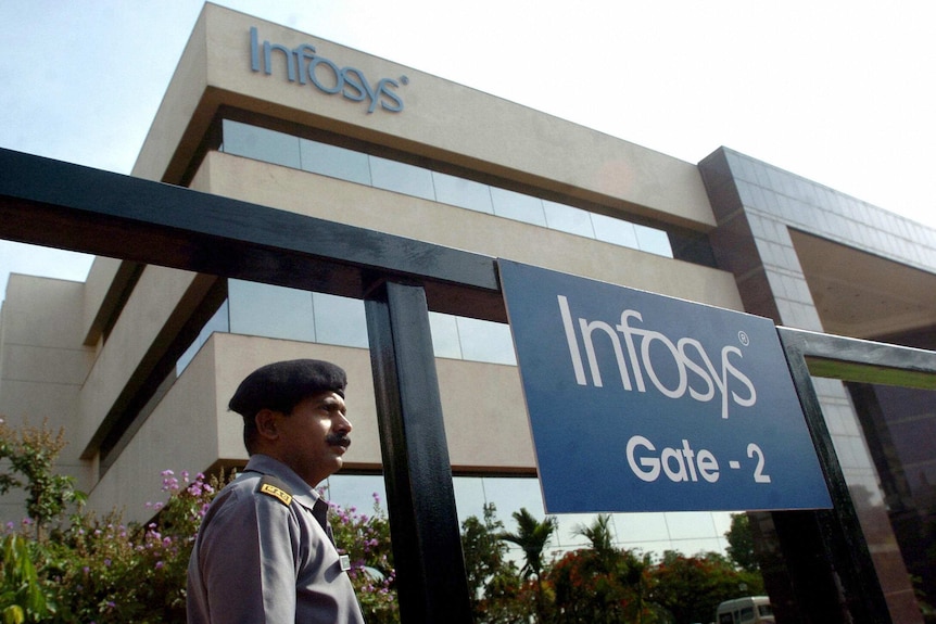 A security guard stands at an entrance gate of India software giant Infosys Technologies in Bangalore, April 14, 2005.