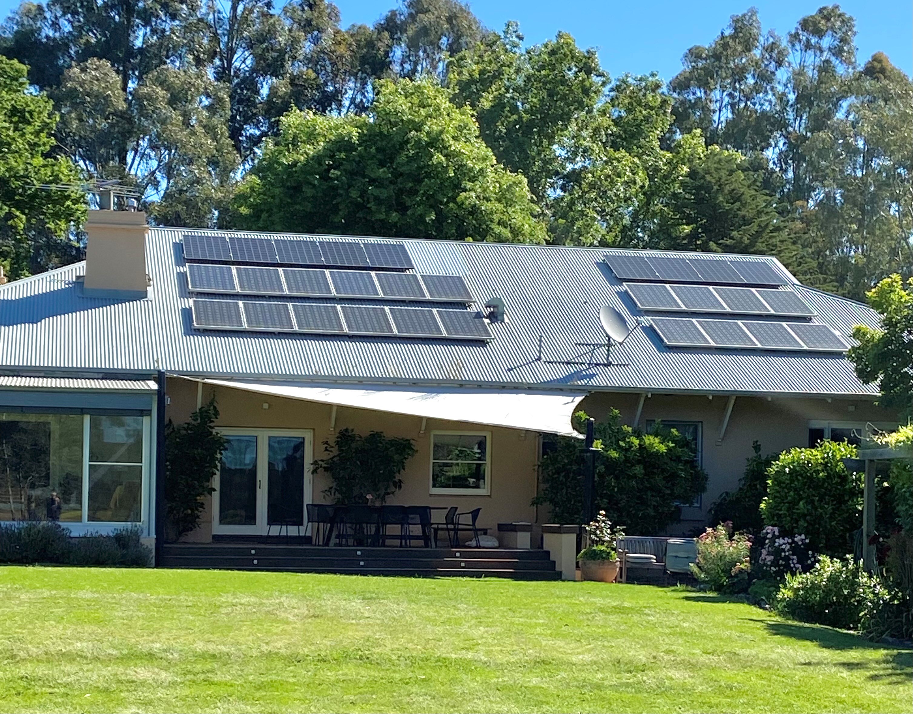 A single-story home with solar panels on the roof