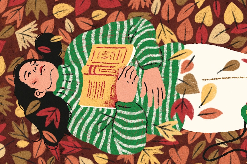 An illustration of a person with long, dark hair lying in autumn leaves, with a yellow book resting open on their chest