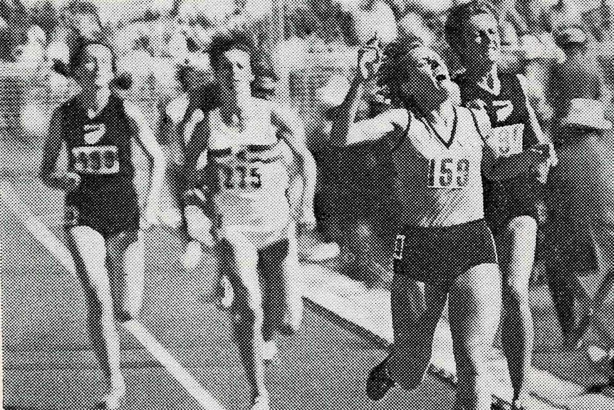 A grainy black and white image of women in a running race.