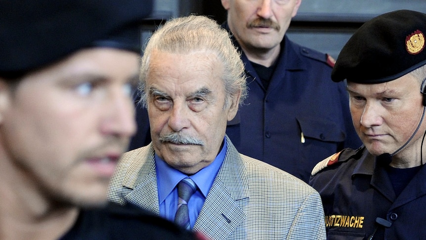 Josef Fritzl stands amid security guards 