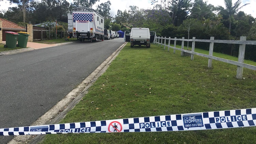 Police at scene where a woman's body was found on the road in Arthur Payne Court at Worongary on Queensland's Gold Coast.