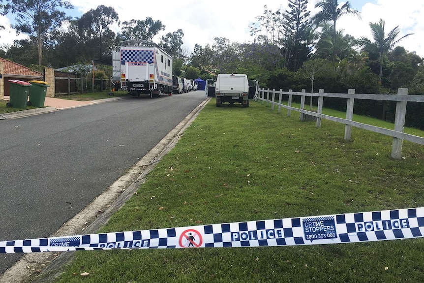 Police at scene where a woman's body was found on the road in Arthur Payne Court at Worongary on Queensland's Gold Coast.