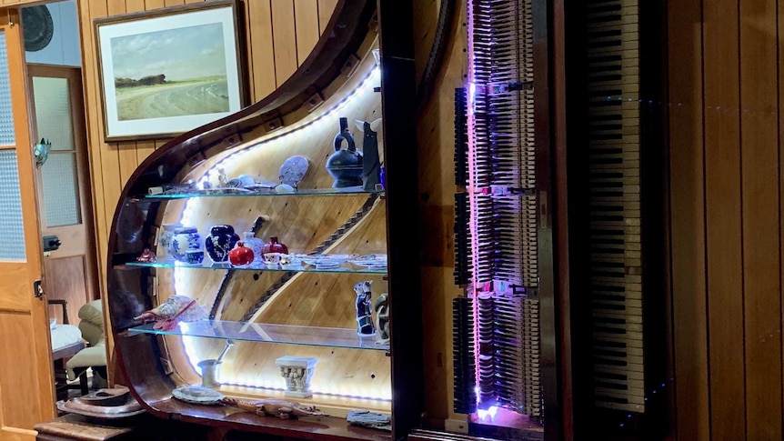 a piano that has been turned into modern shelving