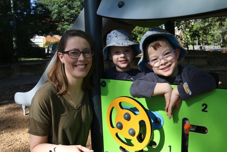 Eliza Howard with her twin sons Fletcher and Isaac Howard in a park.