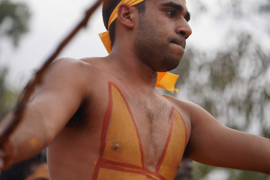 Looking up at Michael as he moves across the opening ceremony grounds.