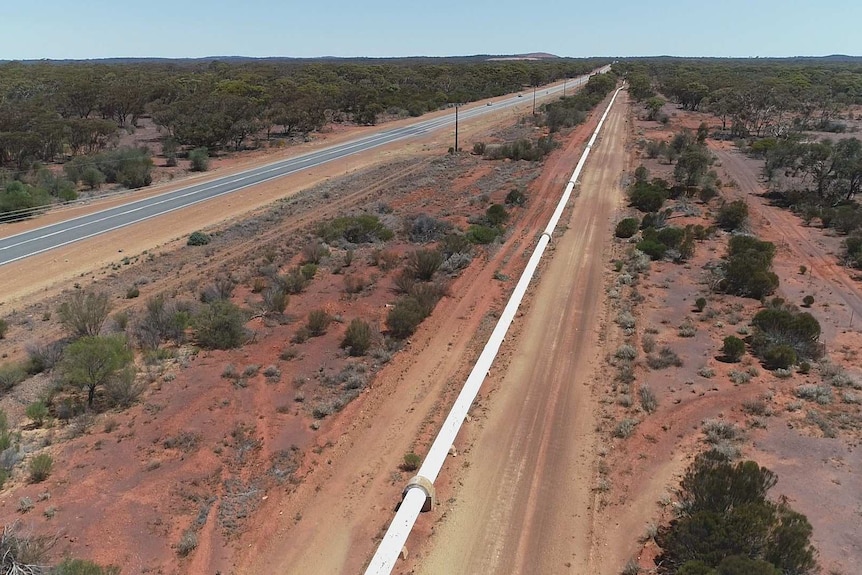 A water pipeline runs parallel to the Great Eastern Highway in WA.