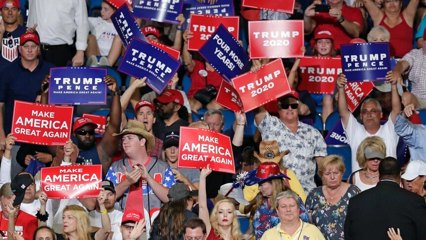 Supporters of President Donald Trump cheer during a rally in his 2020 re-election bid.