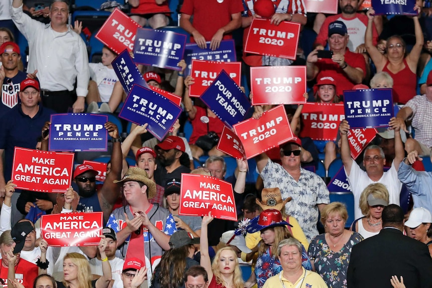 Supporters of President Donald Trump cheer during a rally in his 2020 re-election bid.