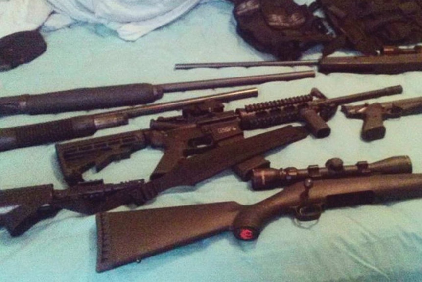 Weapons lying on a bed.