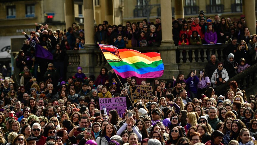 People gather in Plaza del Castillo square during International Women's Day in Pamplona, northern Spain