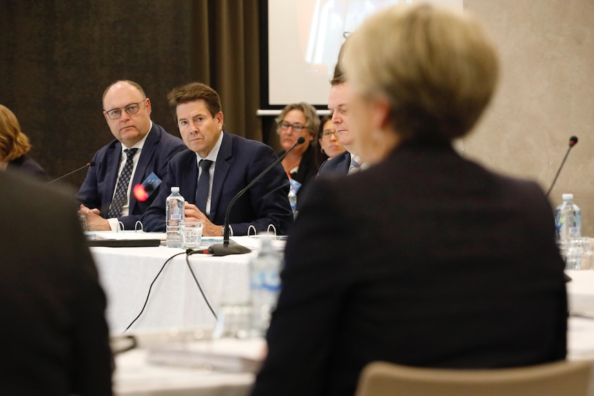 A man looks across a meeting room