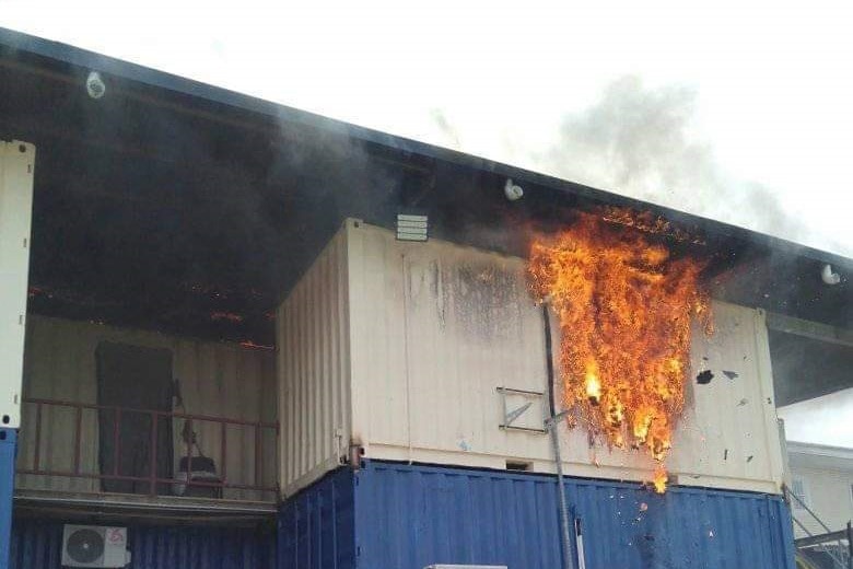 Fire engulfs a shippig container used as accommodation for refugees and asylum seekers on Manus Island, Papua New Guinea.