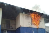 Fire engulfs a shipping container used as accommodation for refugees and asylum seekers on Manus Island, Papua New Guinea.