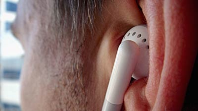 A man listens to an MP3 player through earphones in Sydney.