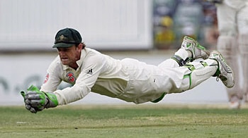 Gilchrist makes a diving catch to dismiss India's Mahendra Dhoni during day three of the Third Test match between Australia a...