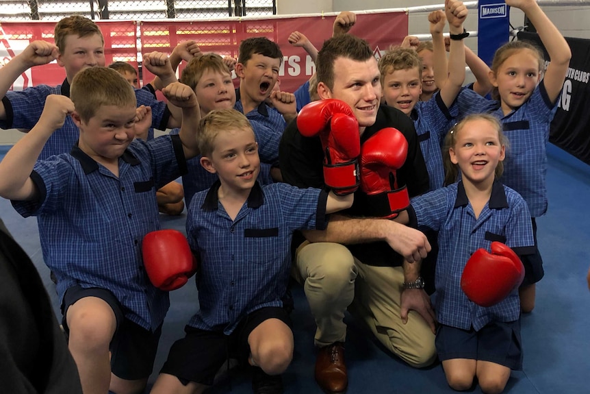 Jeff Horn with a group of kids.