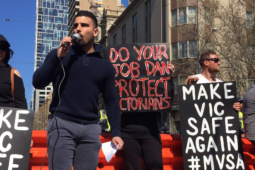 Right-wing Jewish activist Avi Yemini speaks to a crowd.