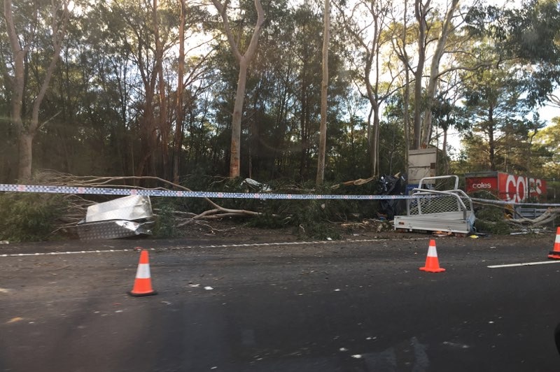 Debris and vehicles in the bush off the M1 motorway