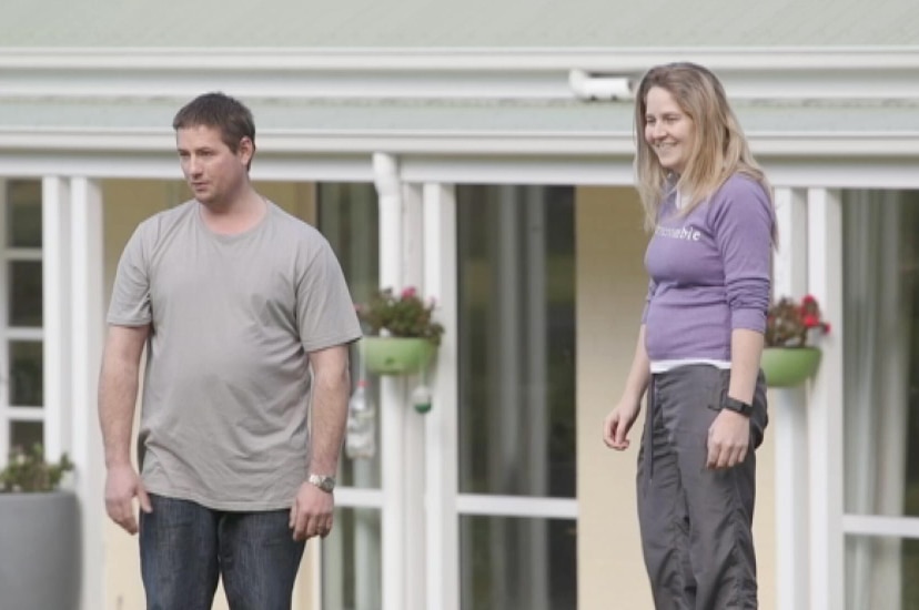 Shelley and James Beverley standing in the backyard outside their house south of Hobart