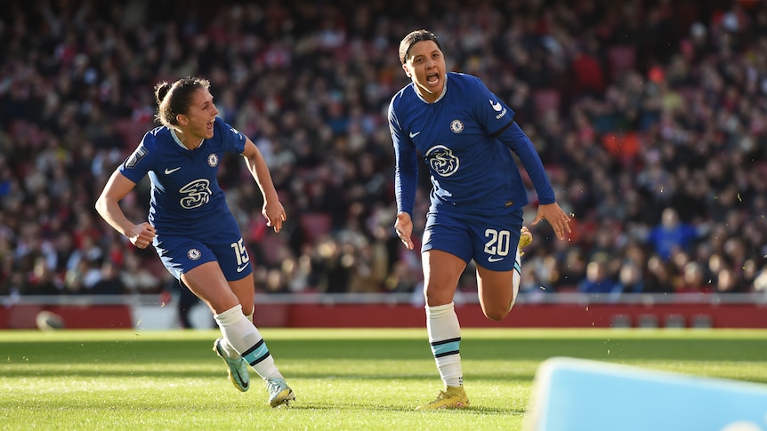 Chelsea's Sam Kerr runs away shouting alongside a teammate after scoring a goal in a Women's Super League match against Arsenal.