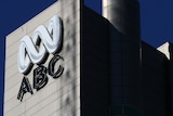 An ABC sign on the outside of a large building.