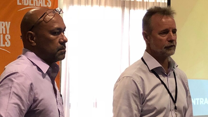 Joe Morrison and Nigel Scullion looking stern as they address a a CLP council meeting.