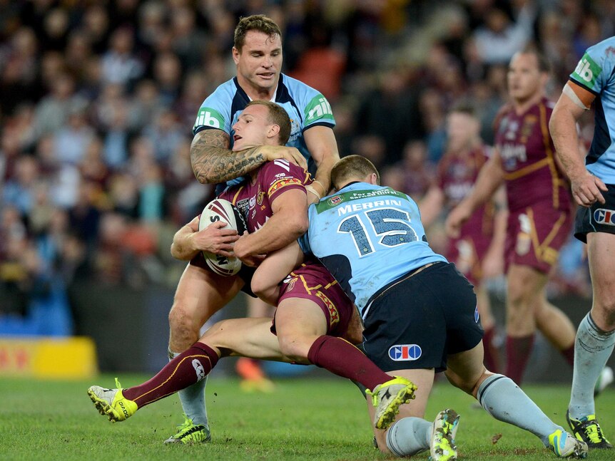 Daly Cherry-Evans is tackled during State of Origin II.