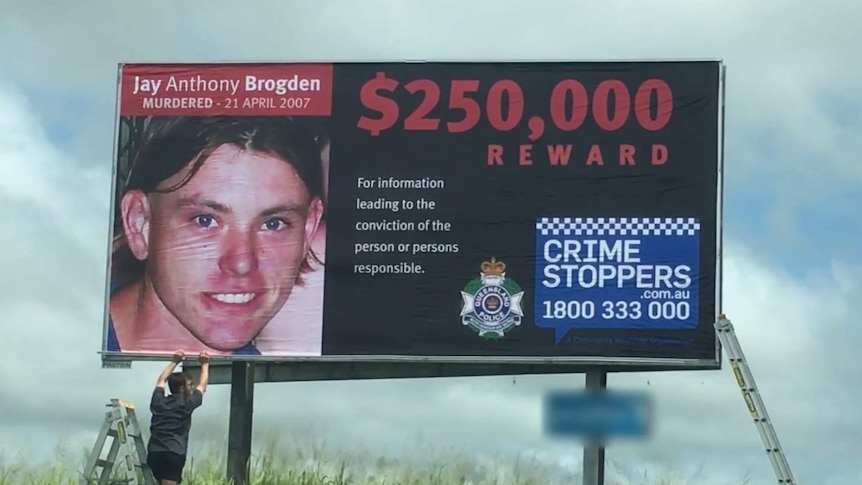 Billboard with image of Jay Anthony Brogden offering $250,000 for information.