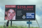 Billboard with image of Jay Anthony Brogden offering $250,000 for information.