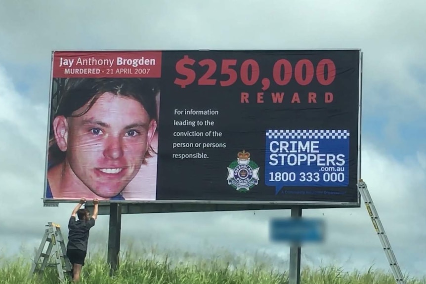 Billboard with image of Jay Anthony Brogden offering $250,000 for information.