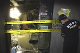 Crews at the scene of a karaoke fire in South Korea
