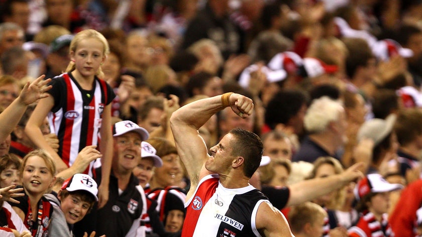 St Kilda's Michael Gardiner celebrates victory with fans.