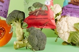 Fresh vegetables with snack food packets