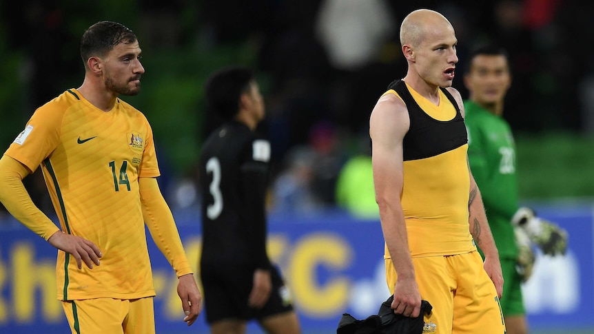 Socceroos' Aaron Mooy and James Troisi look on after beating Thailand