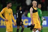 Socceroos' Aaron Mooy and James Troisi look on after beating Thailand