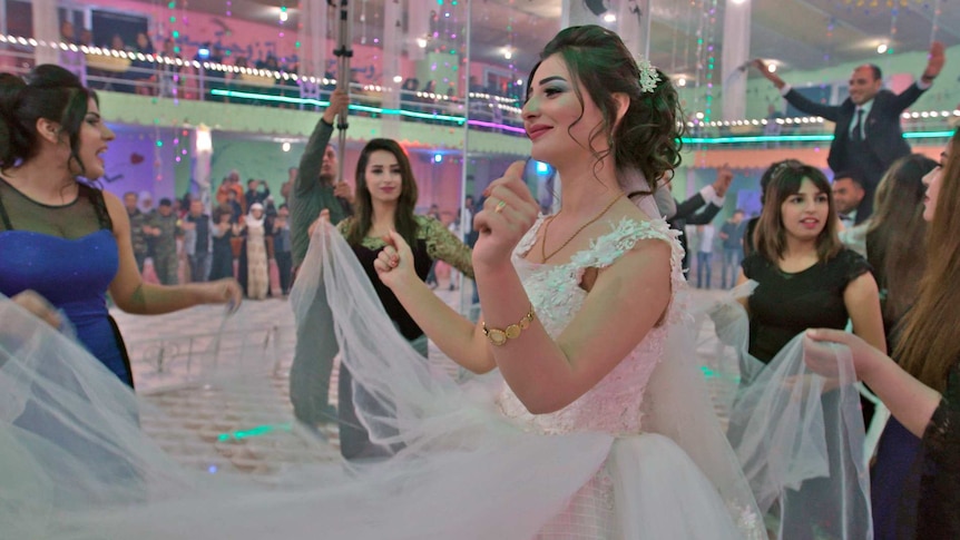 Bercem Abd al-Kadr in her wedding dress.