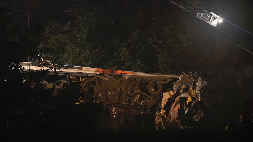 Damaged Belgian train lying on its side