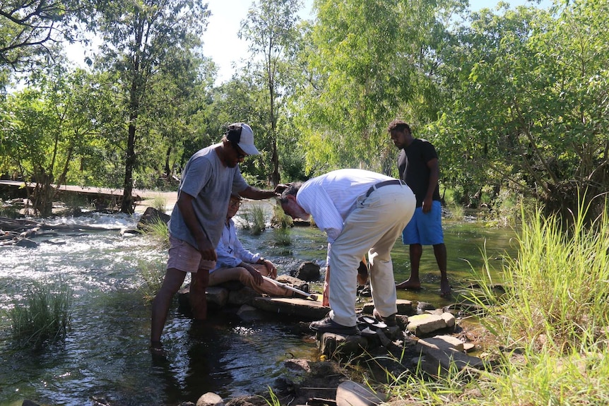 Chris Griffiths wets Justice John Mansfield's head in Timber Creek