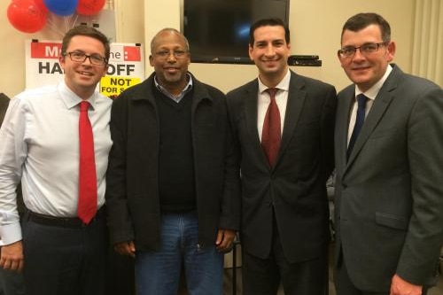 Anthony Carbines, Dr Hussein Haraco, Rick Garotti and Daniel Andrews stand together, wearing suits and ties.