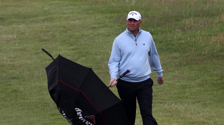 On a roll ... Thomas Bjorn walks down the 18th fairway on the first day of the British Open at Royal St George's.