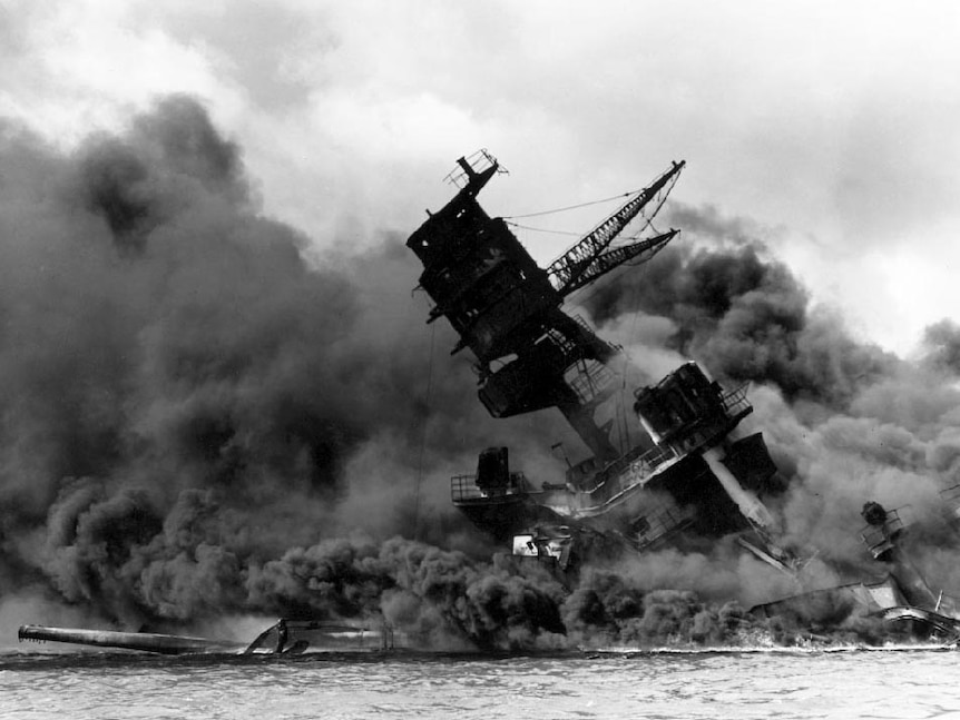 Smoke billows from the USS Arizona during the Japanese attack on Pearl Harbour.
