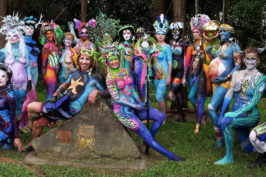 A group of models in full colourful body paint
