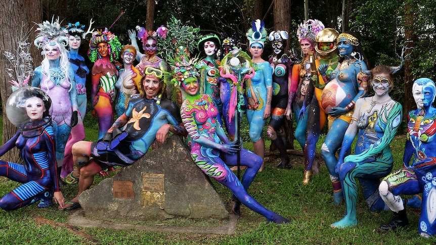 A group of models in full colourful body paint