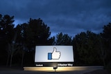 A lit sign is seen at the entrance to Facebook's corporate headquarters location in Menlo Park, California.