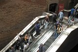 Shoppers on escalater (inside Melbourne Central)